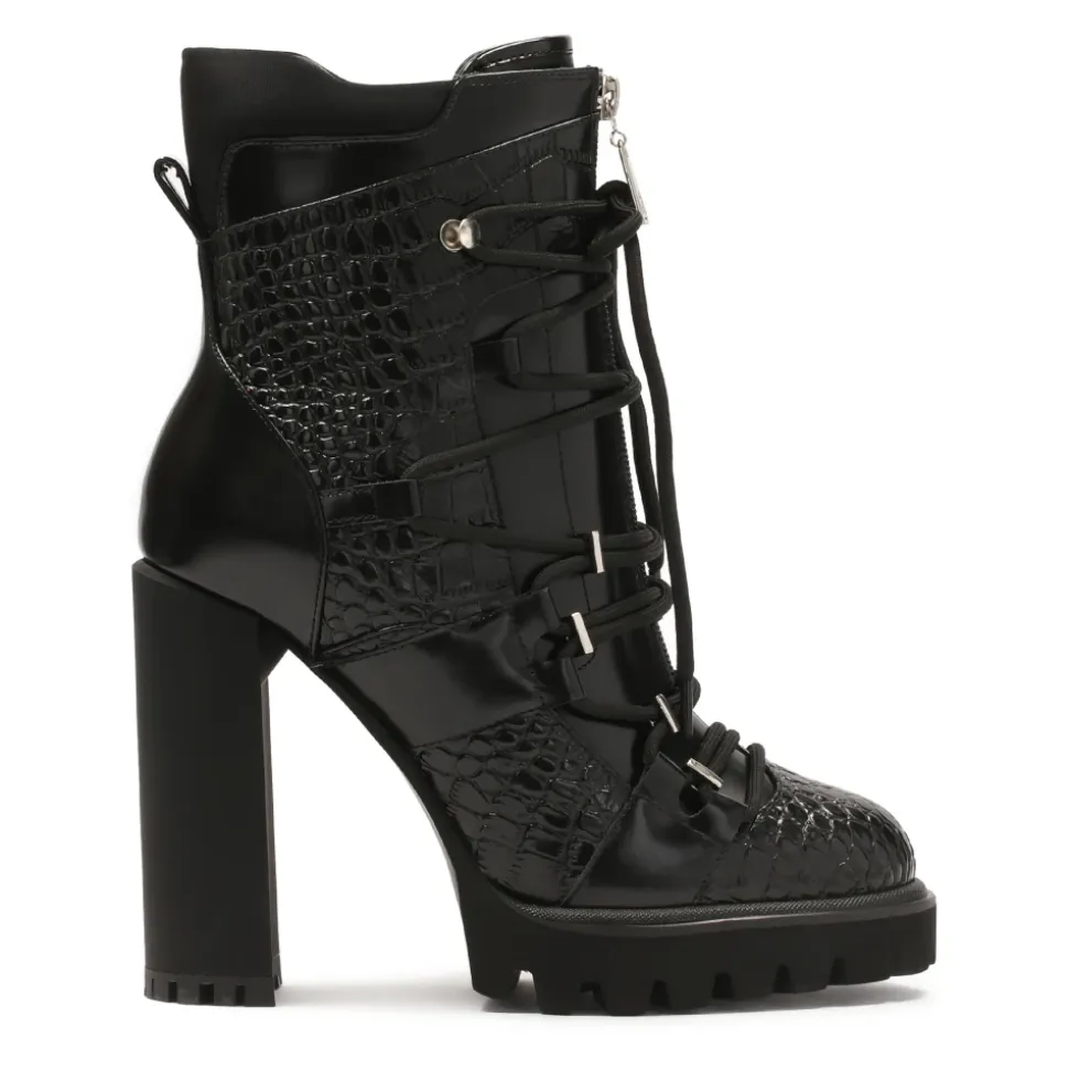 Schwarze geprägte Lederstiefel.Dieses Produkt fällt klein aus.