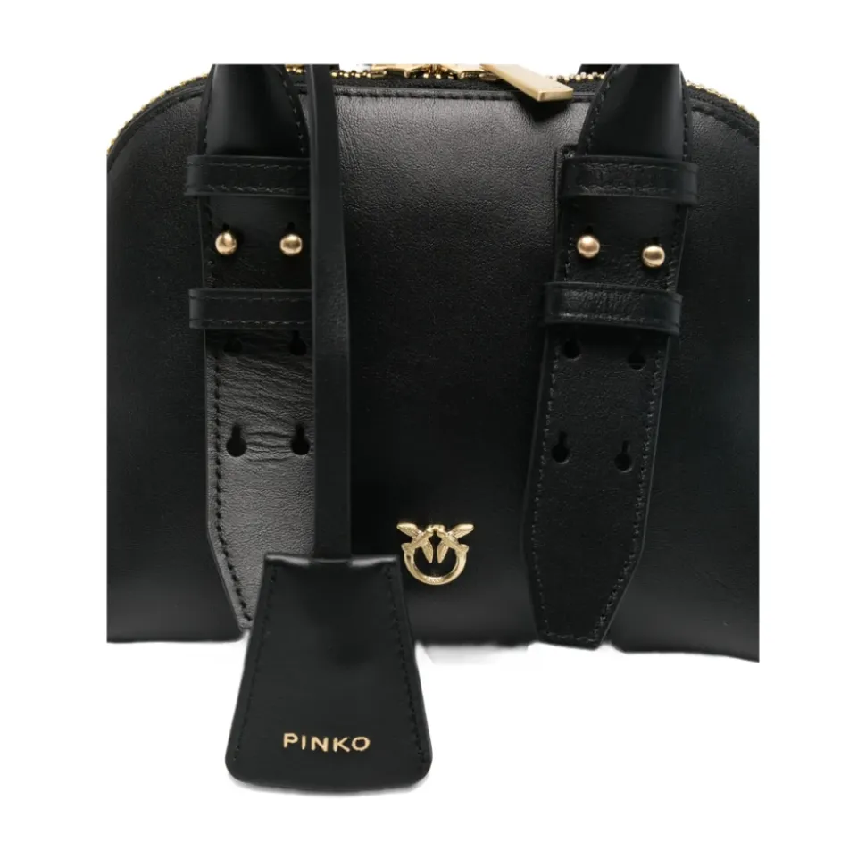 Schwarze Tasche mit oberen Griffen und goldfarbener Hardware